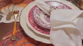 For a video about table setting: Ivory napkin being placed on a table setting. Cloth Napkins Set of 6 - Reusable and Stylish Dining Accessories.