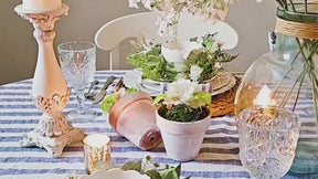 Striped linen tablecloth with matching striped napkins for a coordinated, elegant table setting.