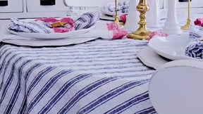 Linen striped tablecloth and napkin set offering a stylish, modern look for dining décor.