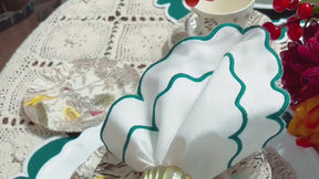 Elegant scalloped cloth napkin featuring neatly embroidered edges, perfect for weddings, parties, and everyday table décor.