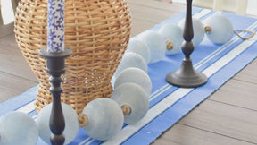 Farmhouse charm with a stylish striped table runner.