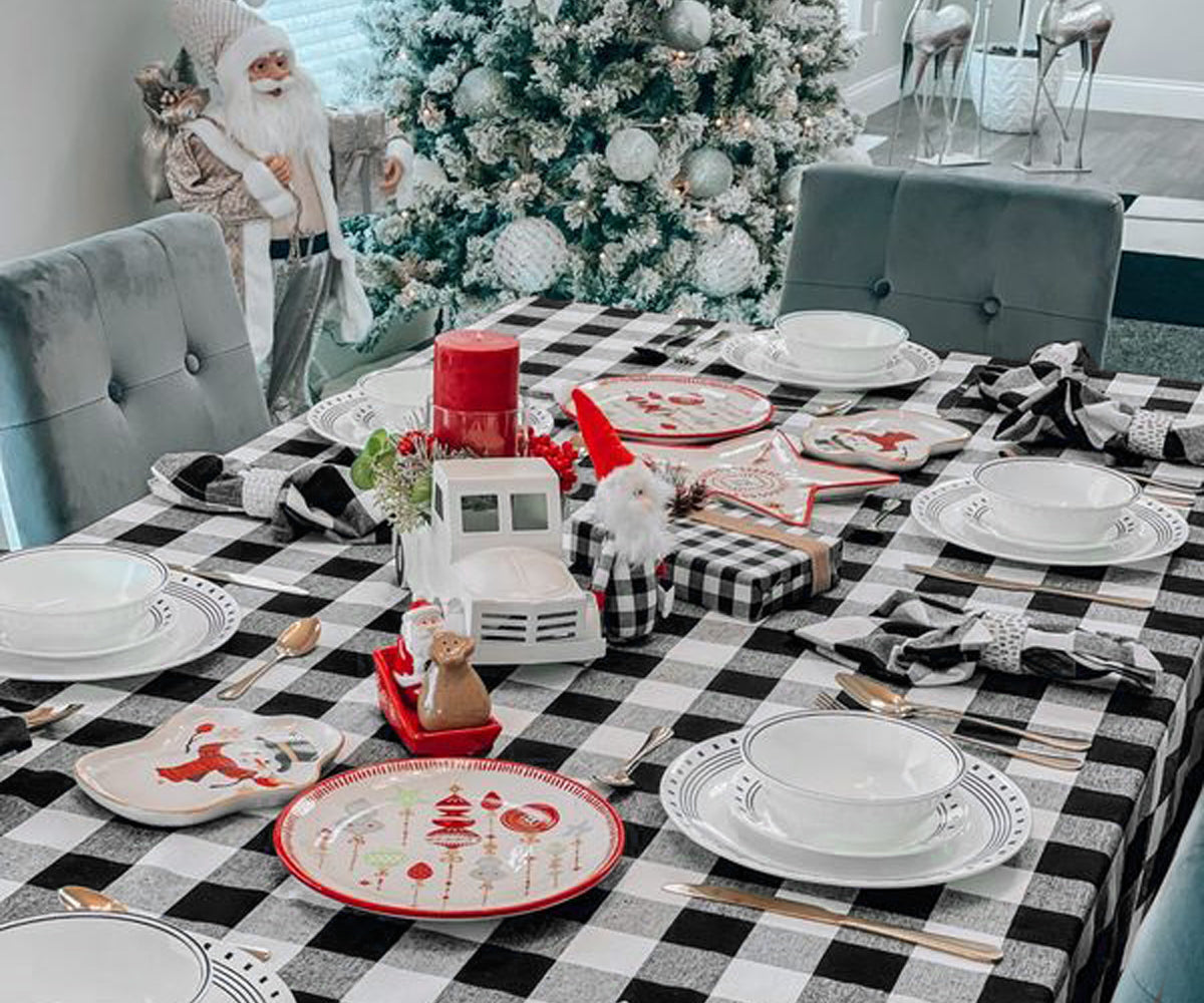 Holiday table decorated with a black buffalo check tablecloth