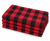 Stacked set of 4 cloth napkins with a red and black buffalo check plaid pattern