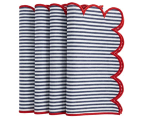 Navy and white striped cloth napkin finished with a contrasting red scalloped trim, neatly folded for table presentation.