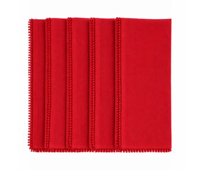 Red cotton pom pom napkins with knotted edge for festive and holiday table décor