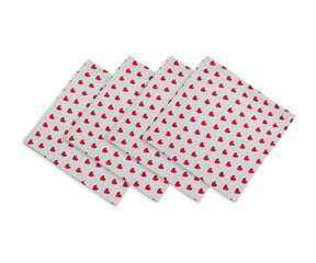 Four white fabric napkins with small red heart patterns, fanned out and displayed in a media gallery next to a heart-pattern thumbnail preview