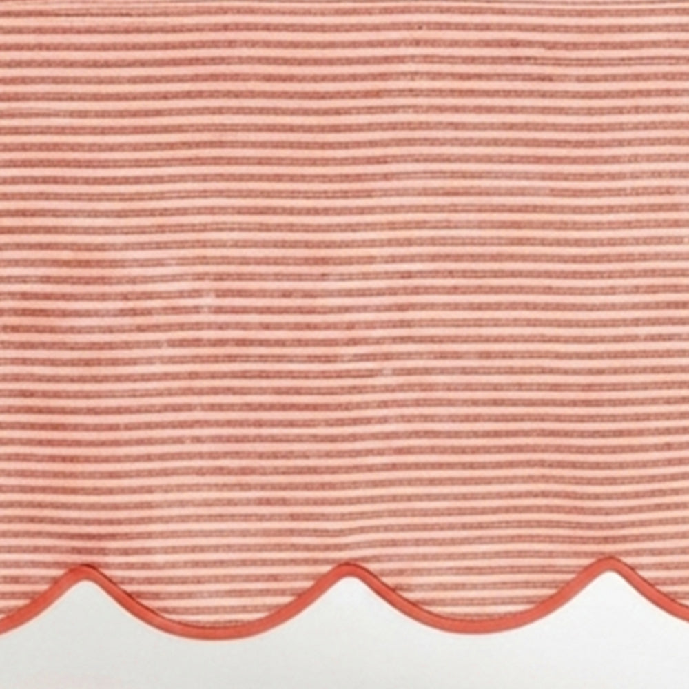 Red striped linen tablecloth material featuring a detailed scallop hem design for kitchen and dining decor.