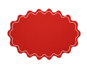 Classic oval fabric placemat with subtle wavy shape and decorative scalloped trim for versatile dining use