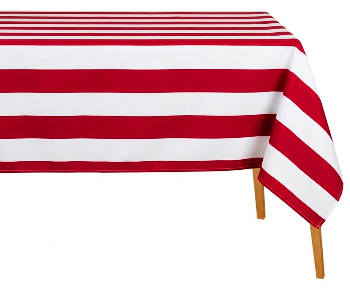Red and white striped cotton tablecloth draped over table, perfect for dining, summer decor, and festive table settings.