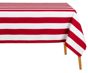 Red and white striped cotton tablecloth draped over table, perfect for dining, summer decor, and festive table settings.