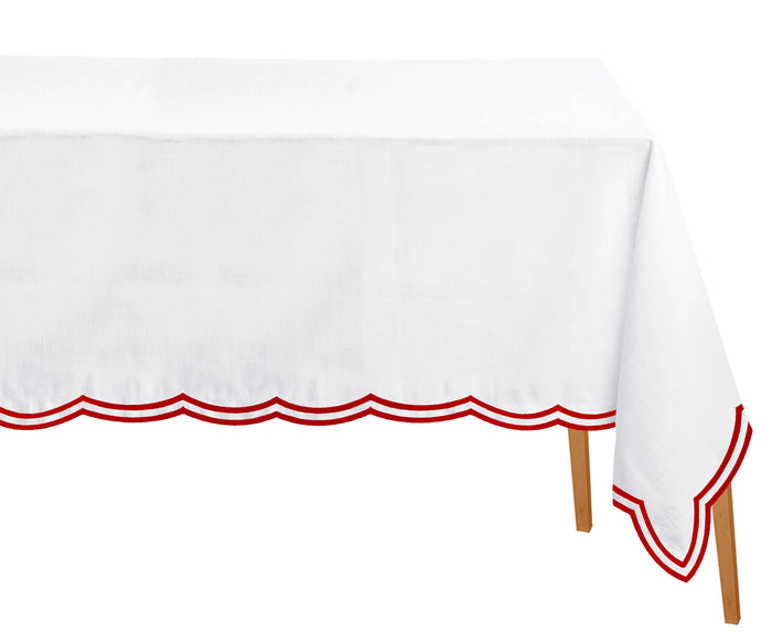 Red cotton tablecloth styled with classic tableware for a cozy and welcoming dinner table