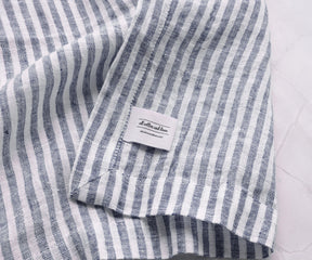 Reusable navy blue linen napkins from All Cotton and Linen offering a sustainable alternative to disposable paper napkins.
