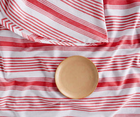 Festive red and white French stripe round tablecloth for farmhouse kitchens