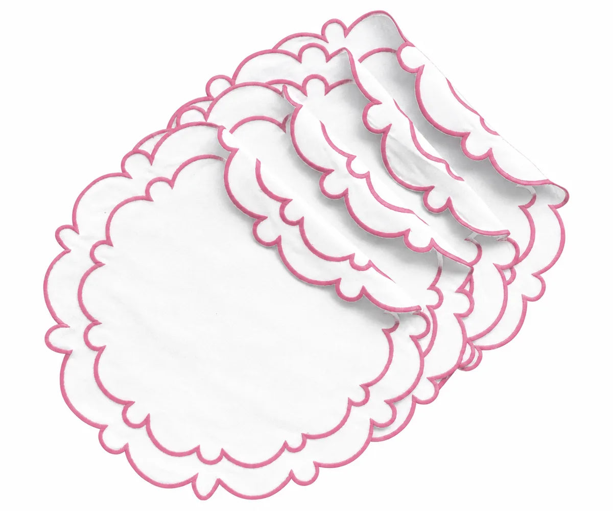 Round pink and white cotton placemats with a white center and pink scalloped edges, designed for dining table decor and everyday meals.