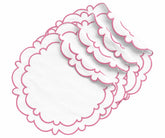 Round pink and white cotton placemats with a white center and pink scalloped edges, designed for dining table decor and everyday meals.