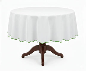 White round cotton tablecloth featuring a soft green scalloped edge, crafted from 100% cotton for a smooth, elegant drape. This white tablecloth with green trim suits round dining tables, blending farmhouse and modern décor styles, ideal for everyday dining, brunches, garden parties, weddings, and special occasions.