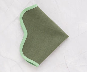 Durable cotton placemat in green, 15 and 17 inch sizes with scalloped edge