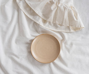 Soft farmhouse-style tablecloth with elegant ruffle trim for weddings