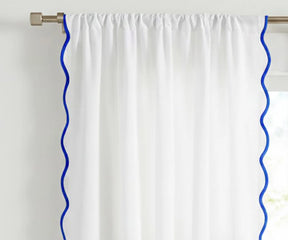 White scalloped curtain panel with royal blue trim