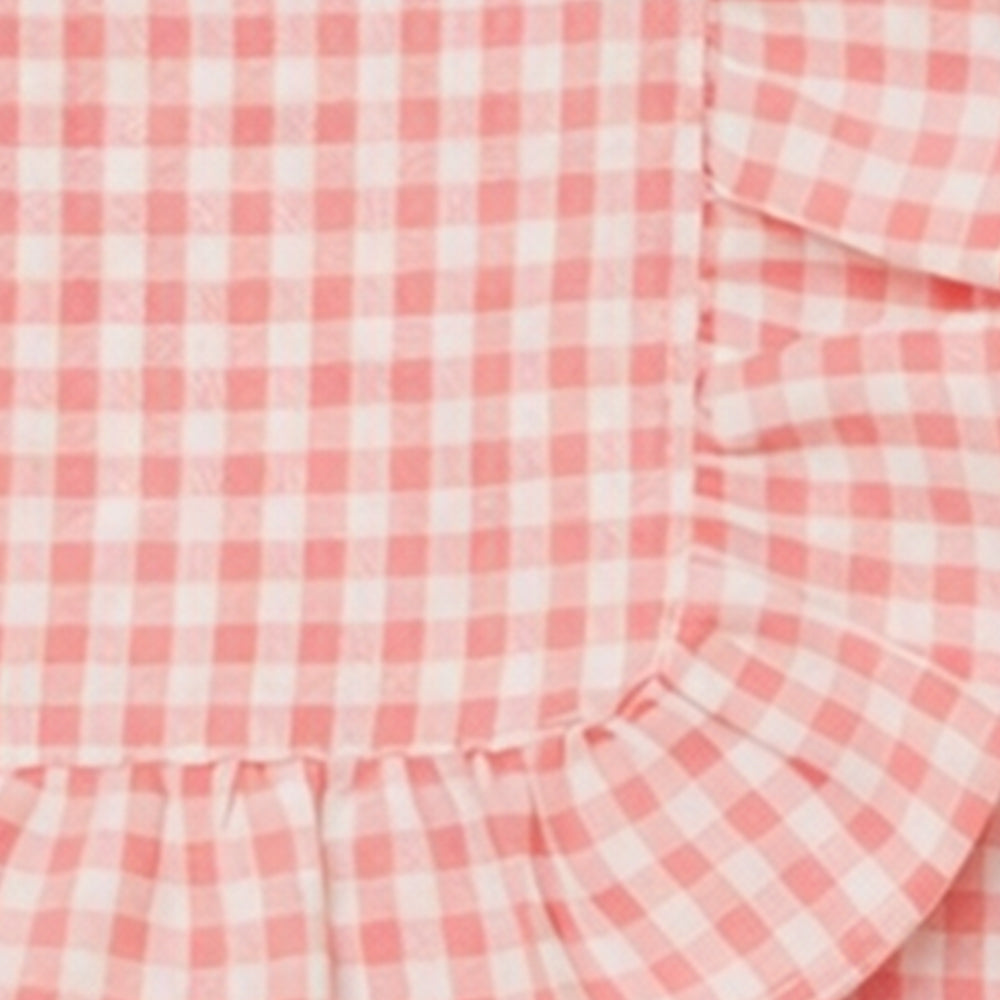 Decorative blush pink checked cotton napkin with ruffle trim