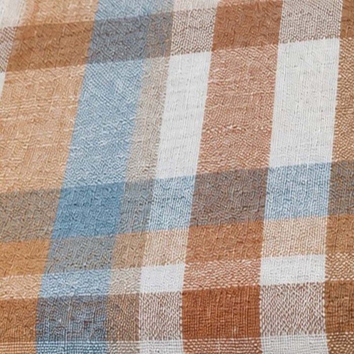 Close-up fabric swatch of a rust brown, light blue, and beige plaid pattern