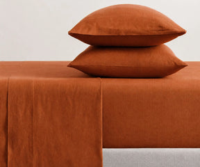 Rust orange linen sheet set for queen and king beds, stonewashed terracotta bedding with soft cooling fabric for minimalist and boho bedroom decor