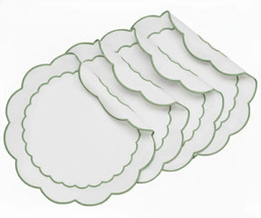 White round scalloped cotton placemats with sage green embroidery, eco-friendly embroidered placemats for modern farmhouse and everyday dining table décor.