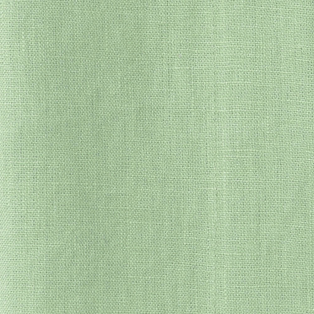 Green cotton curtain fabric texture close-up