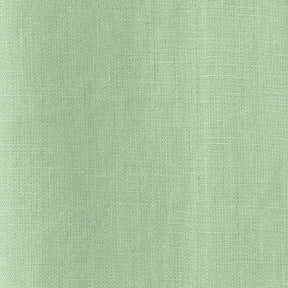 Green cotton curtain fabric texture close-up