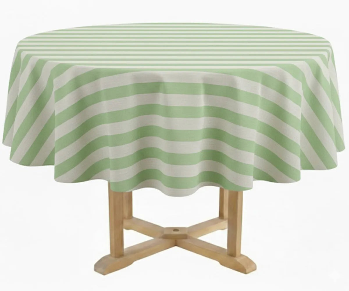 Cotton round tablecloth 60 inch with green and white cabana stripes draped over a round patio table, creating a bright and modern farmhouse tablescape. This reusable striped tablecloth is machine washable and ideal for everyday dining, outdoor brunch, summer entertaining, or elegant event décor paired with neutral placemats and dinner napkins.