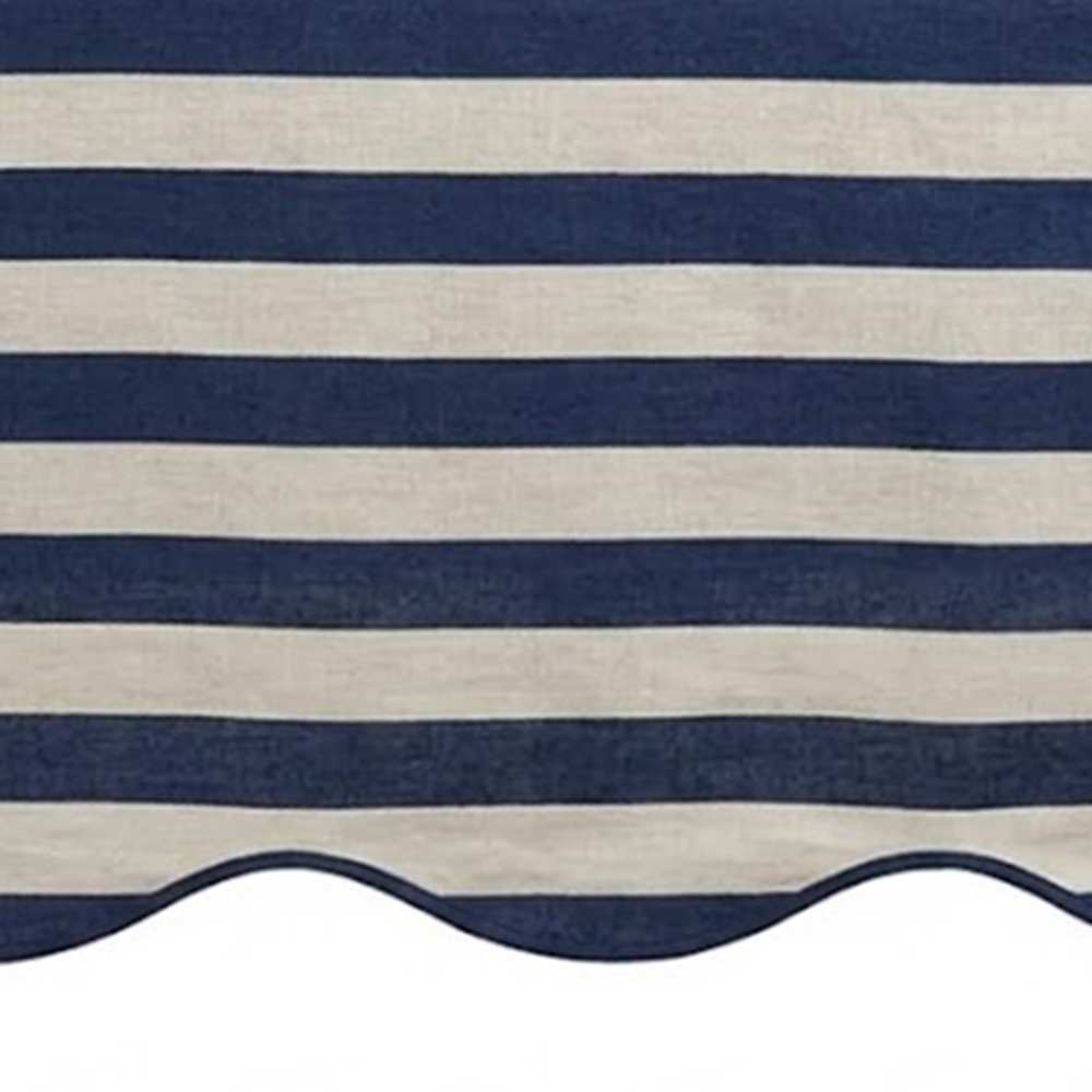Navy blue and white striped awning with scalloped edge
