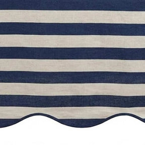 Navy blue and white striped awning with scalloped edge