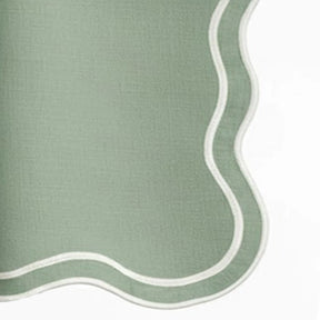 sage green scalloped edge cotton napkins with elegant embroidered trim, reusable cloth napkins styled for festive dining, christmas tables, weddings, and everyday table décor