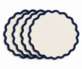 Ivory cotton dining placemat featuring a navy blue scalloped border, reusable table accessory for coastal, nautical, farmhouse, traditional, and classic home dining table decor