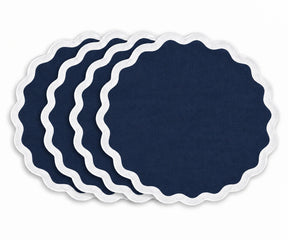 Navy blue cotton dining table placemat with white scalloped border, reusable fabric table accessory for coastal, nautical, farmhouse, traditional, and elegant home dining decor