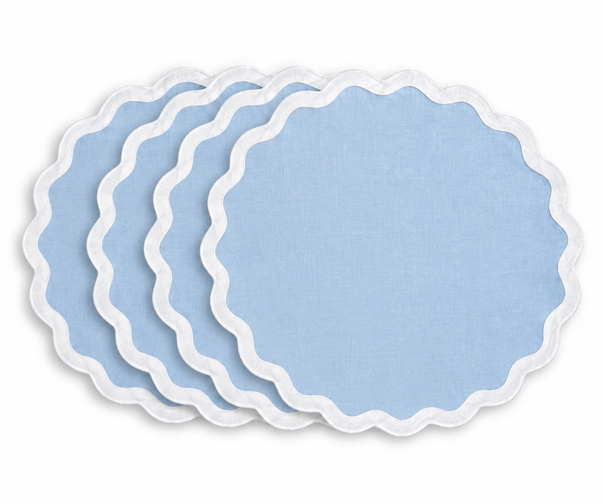 Soft light blue cotton dining placemat with contrasting white scalloped border, reusable table accessory for coastal, beach house, cottage, farmhouse, and relaxed dining table decor