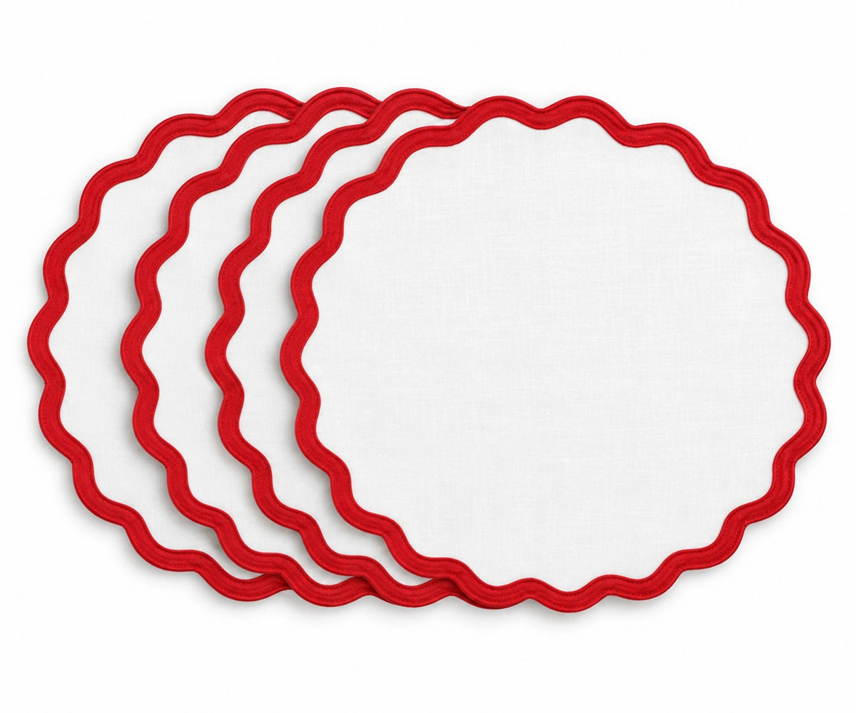 Solid white cotton placemat with red scalloped edge trim, decorative fabric table mat for dining tables, festive meals, holiday gatherings, family dinners, and everyday home decor