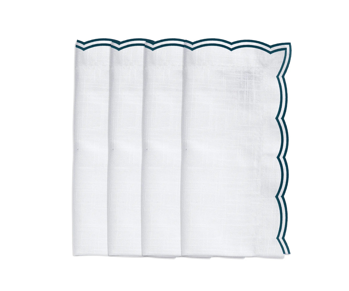 Green embroidered scalloped napkins folded neatly for a spring-themed table
