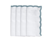 Green embroidered scalloped napkins folded neatly for a spring-themed table Embroidered green cotton dinner napkins