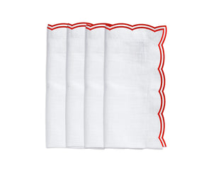 Red scalloped napkins styled for a festive holiday tablescape