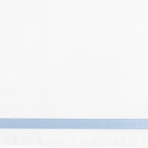 White fabric with a thin light blue horizontal stripe near the bottom edge.
