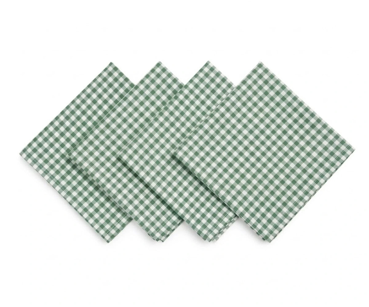 Stack of green buffalo check cotton napkins folded neatly