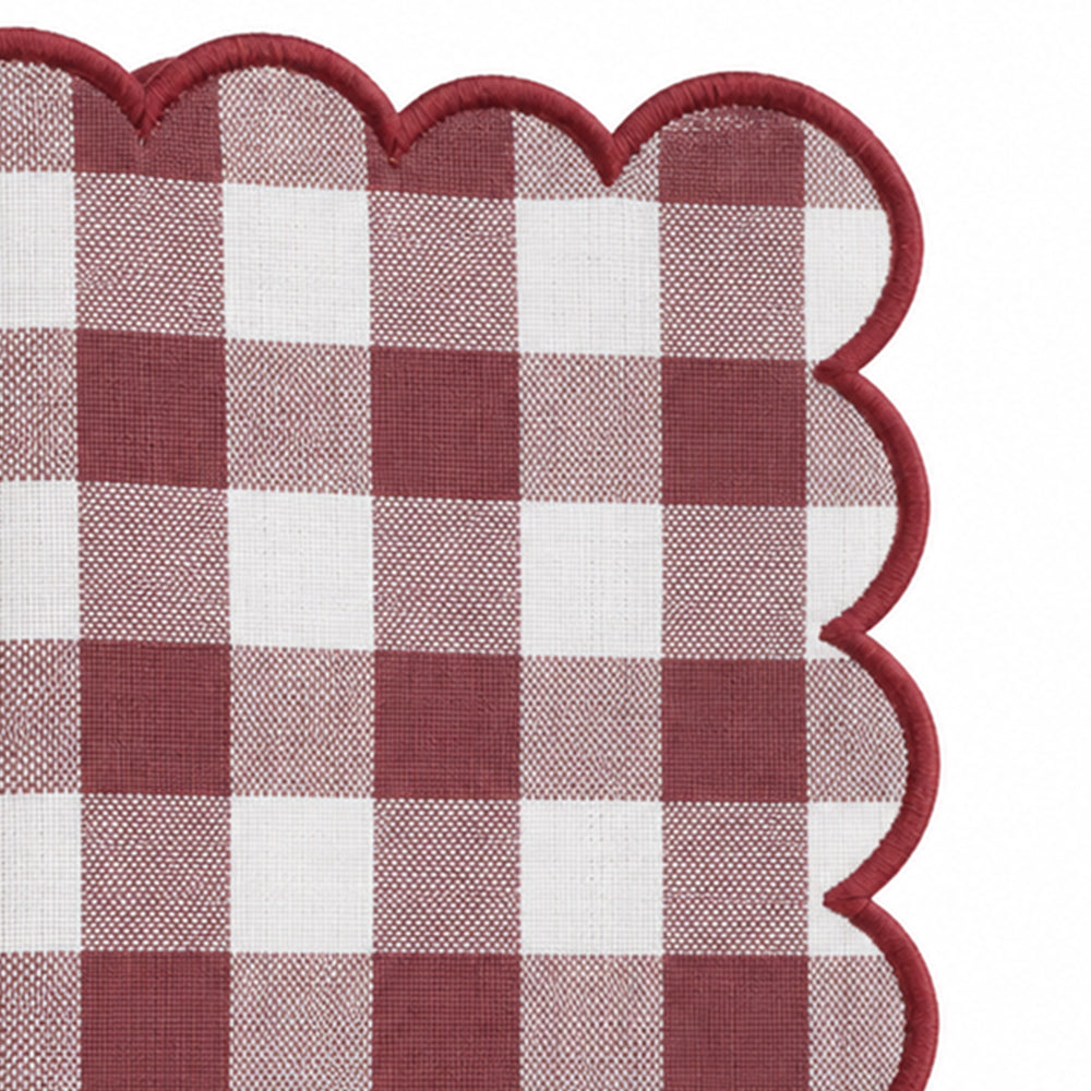 Close-up of dark red and white gingham cotton dinner napkin with matching red scalloped embroidered edge