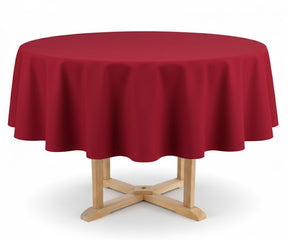 Round table with a red tablecloth on a white background