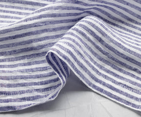 Soft washed blue pinstripe cloth napkins featuring natural linen texture and everyday luxury