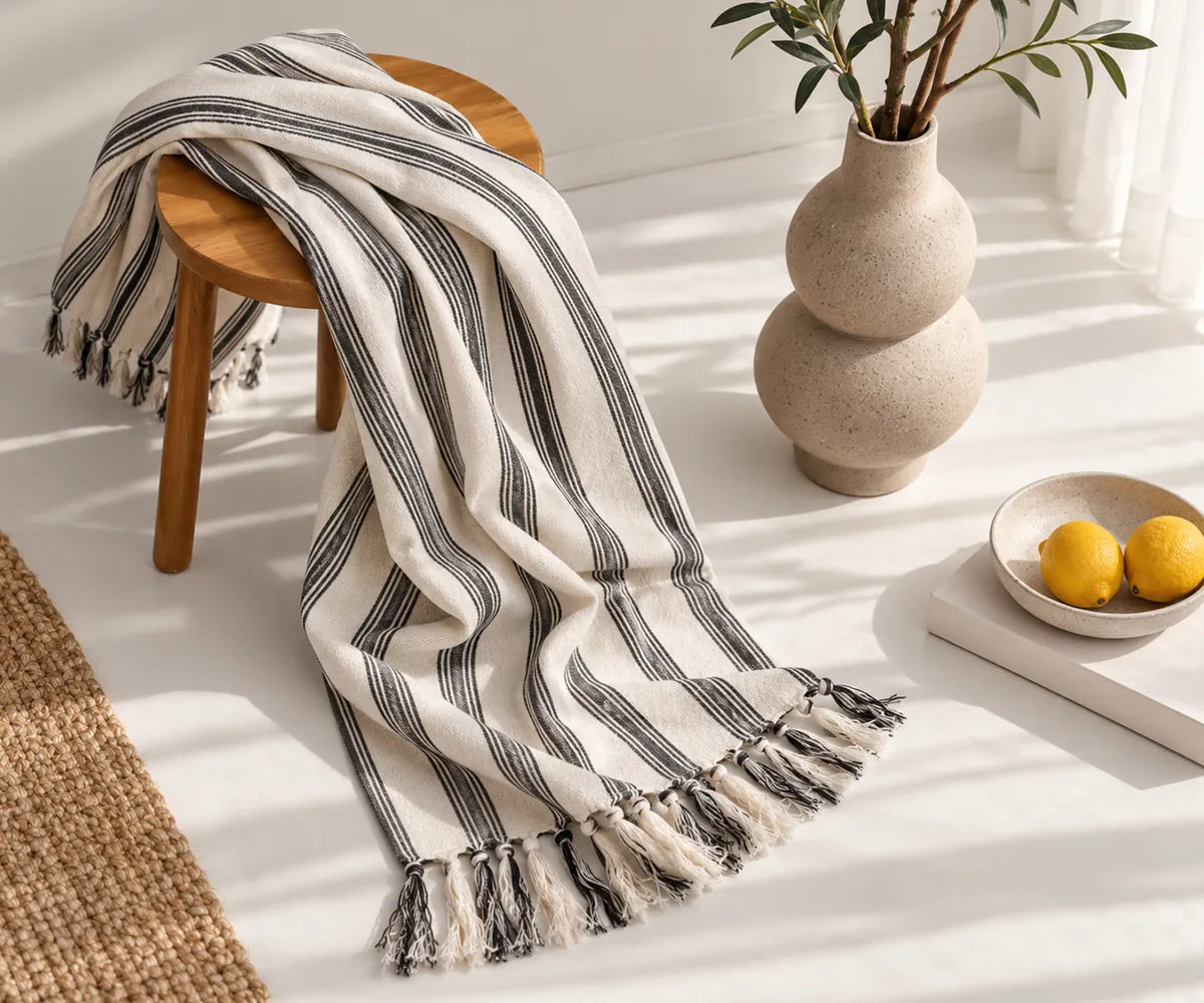 Black and white striped cotton throw blanket for cozy fall and autumn home décor