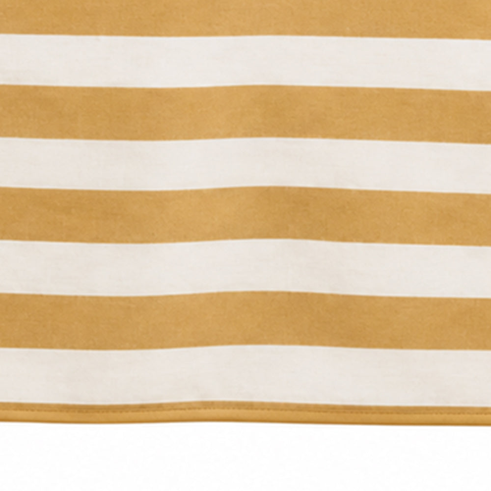 A close-up of a striped textile with alternating warm yellow and off-white horizontal bands, showing a soft woven texture and a stitched edge along the bottom.