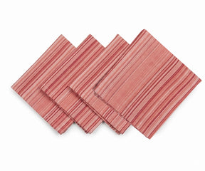 Red striped cotton dinner napkins folded and stacked for table setting