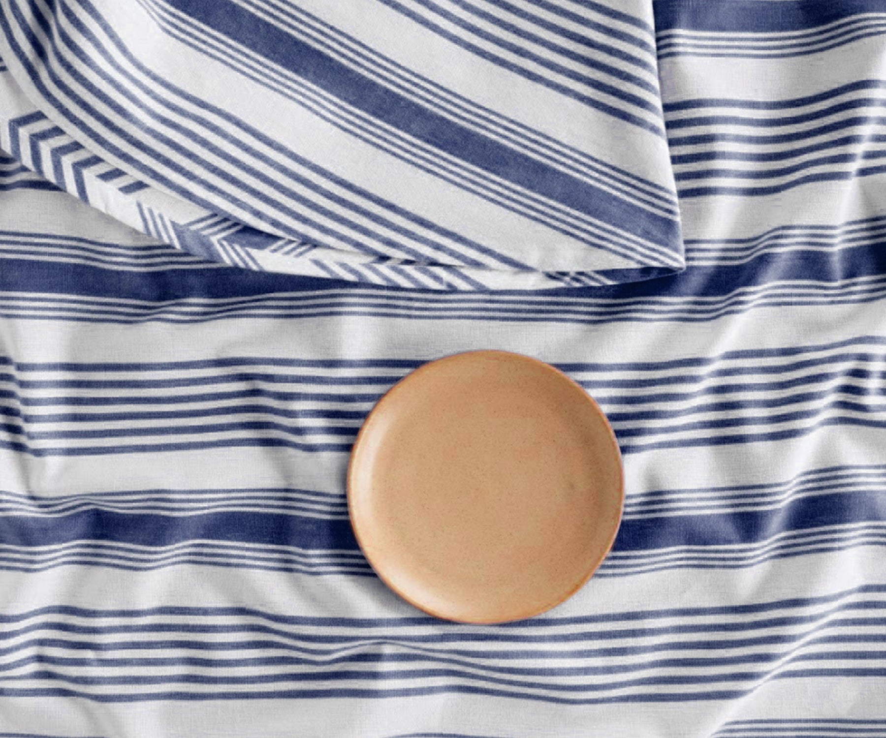 Elegant navy and white French stripe round tablecloth with soft cotton drape