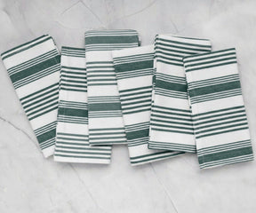 Green striped cotton cloth napkins arranged in a set